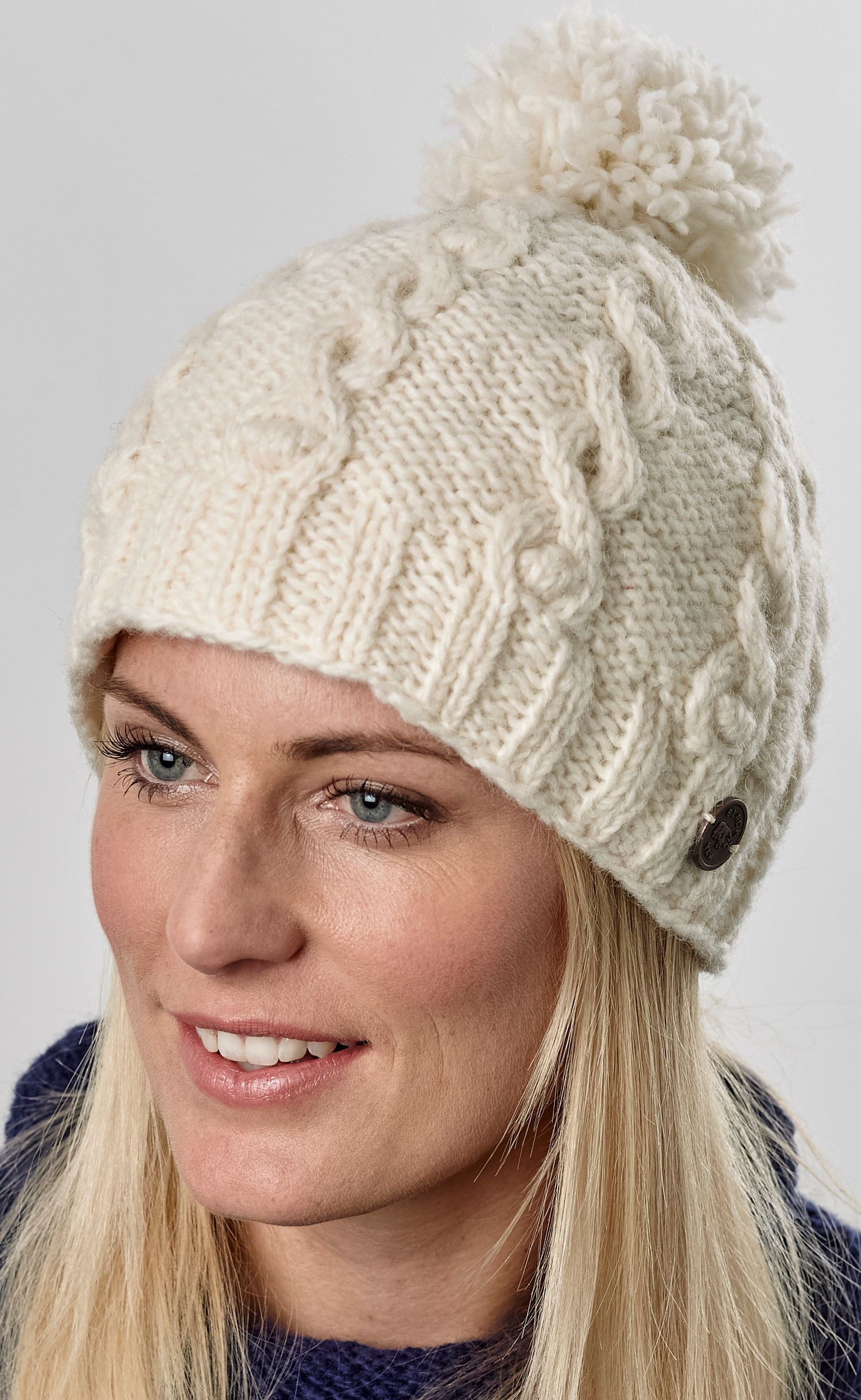 Download Half fleece lined - pure wool - cable - bobble hat - White ...